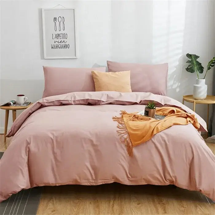 Soft blush pink duvet cover set with matching pillowcases and cozy orange throw in navy blue solid color decorbites cotton 4pcs bedding set