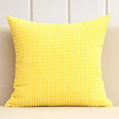 Bright yellow waffle-textured throw pillow complementing navy and charcoal corduroy corn grain cushion cover decorbites set