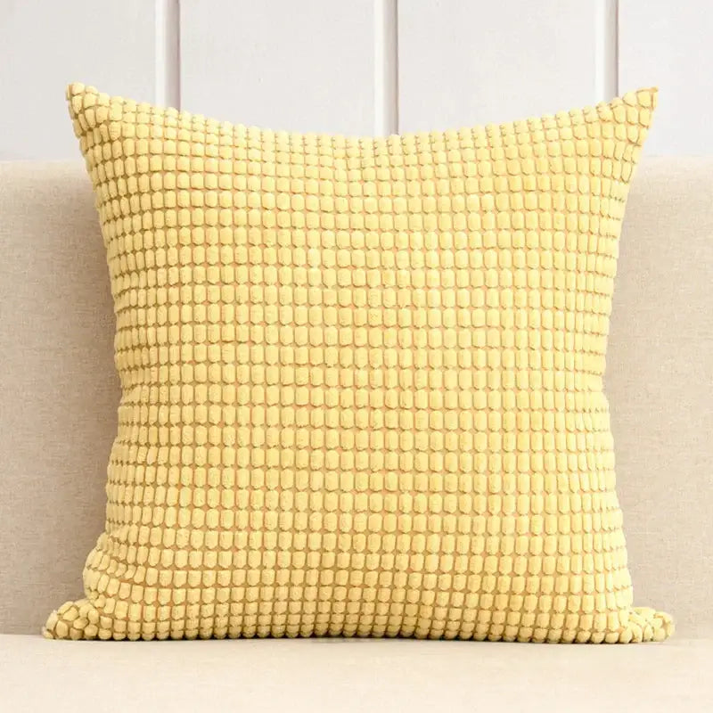 A soft yellow cushion cover with textured woven corn grain pattern for decorbites corduroy corn living room set