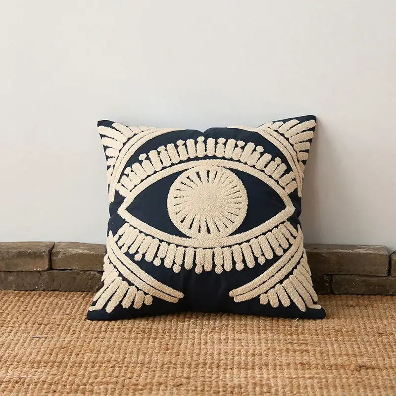 Navy blue pillow cover with cream embroidered eye design made from decorbites embroidered cotton for living room decor
