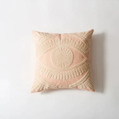 A blush pink pillow cover with a cream embroidered cotton eye design for living room decorbites decor
