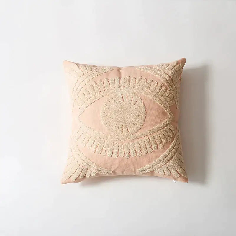 A blush pink pillow cover with a cream embroidered cotton eye design for living room decorbites decor