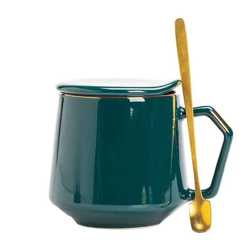 Deep teal ceramic mug set with matching lid gold-trimmed handle and golden spoon for kitchen drinkware use