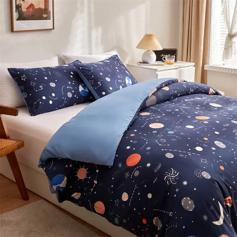 Navy blue space-themed bedding set with cosmos luminous patterns in white orange and light blue on soft fabric
