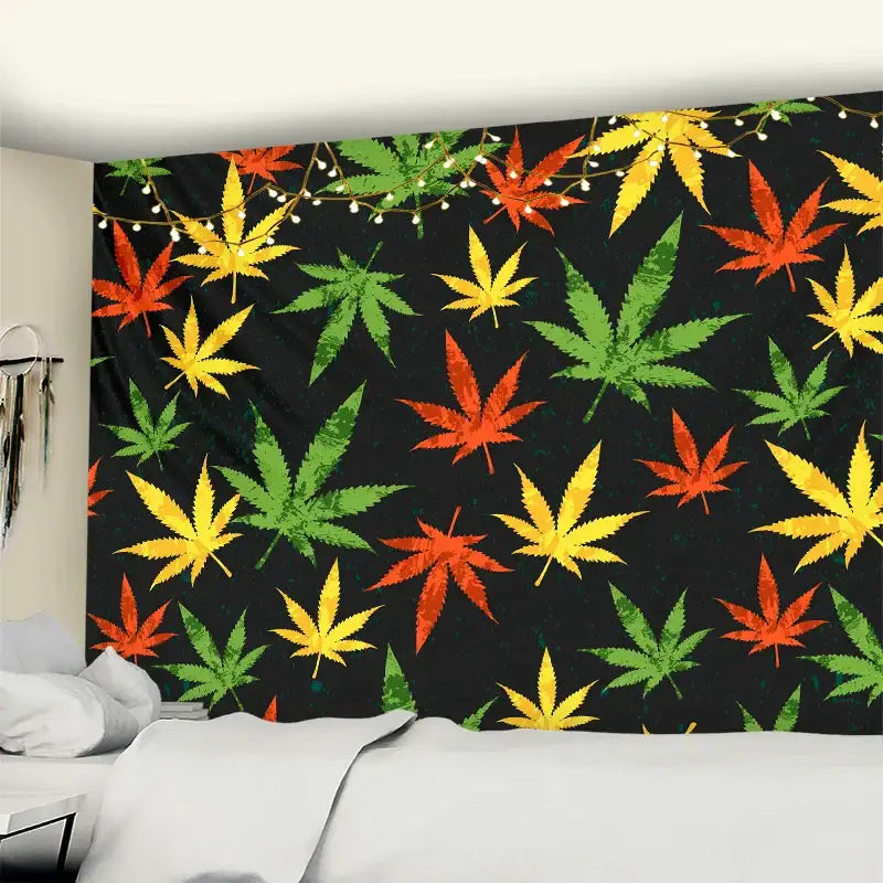 Black wall tapestry with vibrant red green and yellow cannabis leaves used as printed maple leaf bedroom wall decor