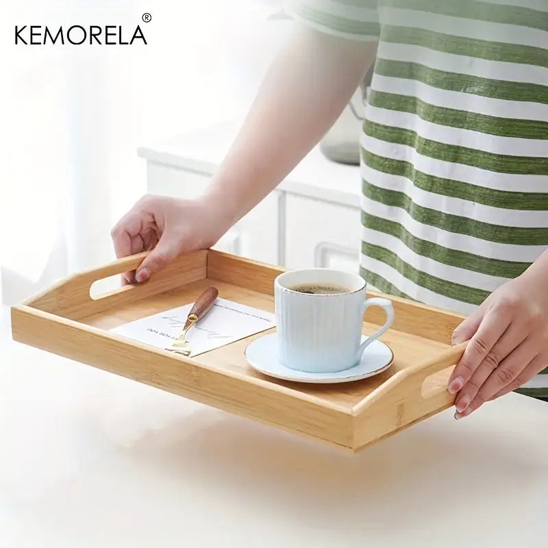 Nested light brown rectangular wooden trays made of light-colored bamboo with integrated handles for kitchen storage organization