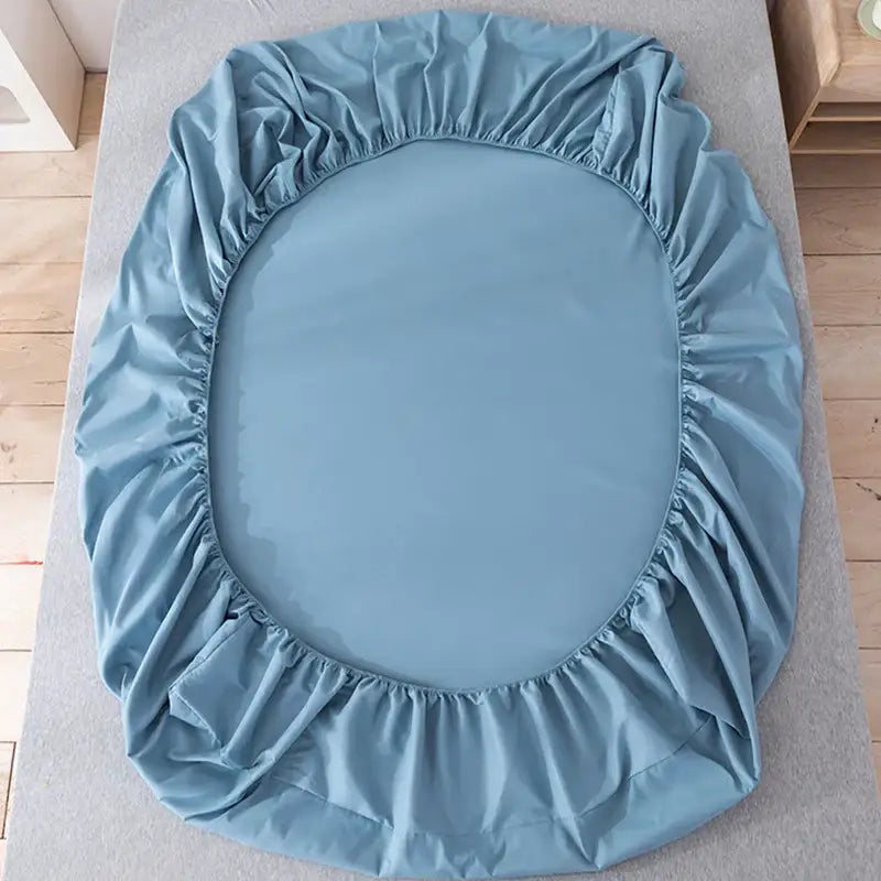 Light blue neutral microfiber double bed elastic fitted sheet with smooth glossy fabric finish for bedroom use
