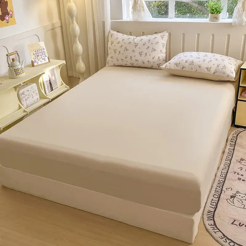 Cream-colored neutral microfiber double bed elastic fitted sheet with smooth finish and subtle bed elastic fitted edge