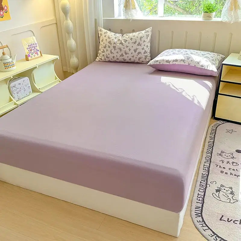 A soft lavender microfiber fitted sheet with double bed elastic for a snug and smooth bed cover