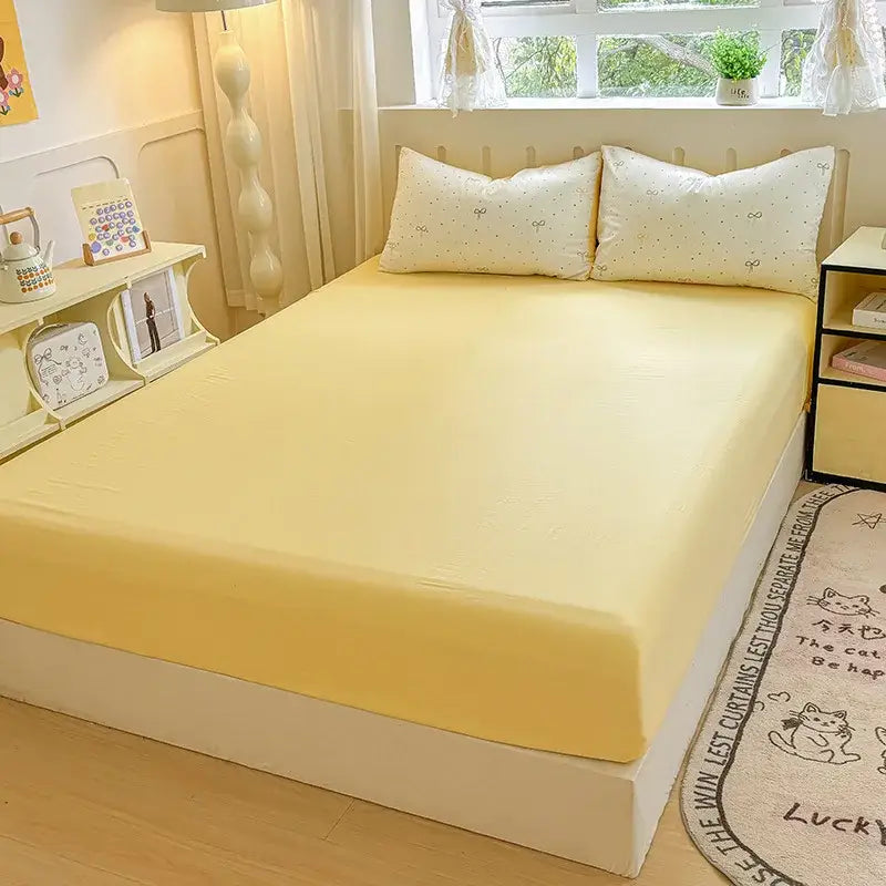 Soft yellow microfiber double bed elastic fitted sheet with smooth textured surface and subtle elasticized edges