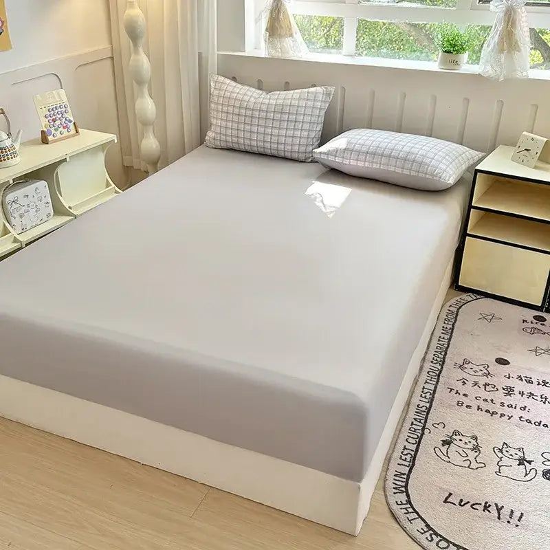 A soft light gray microfiber fitted sheet with a smooth texture and snug fit for double bed elastic use