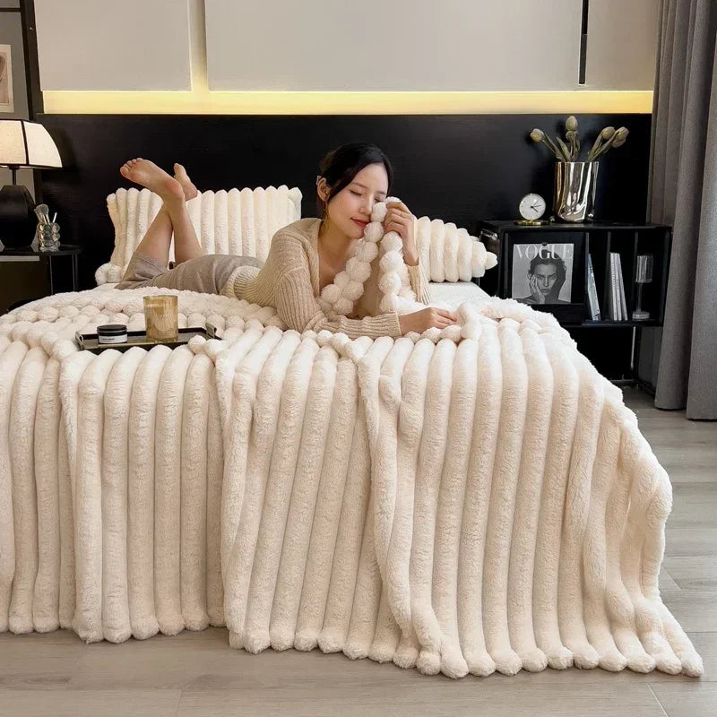 Cream-colored plush ribbed throw blanket made of soft coral fleece with bamboo fiber for warm autumn comfort on beds and sofas