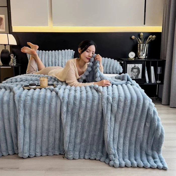 Light blue plush ribbed throw blanket made of soft coral fleece with bamboo fiber for autumn warm sofa and bed use