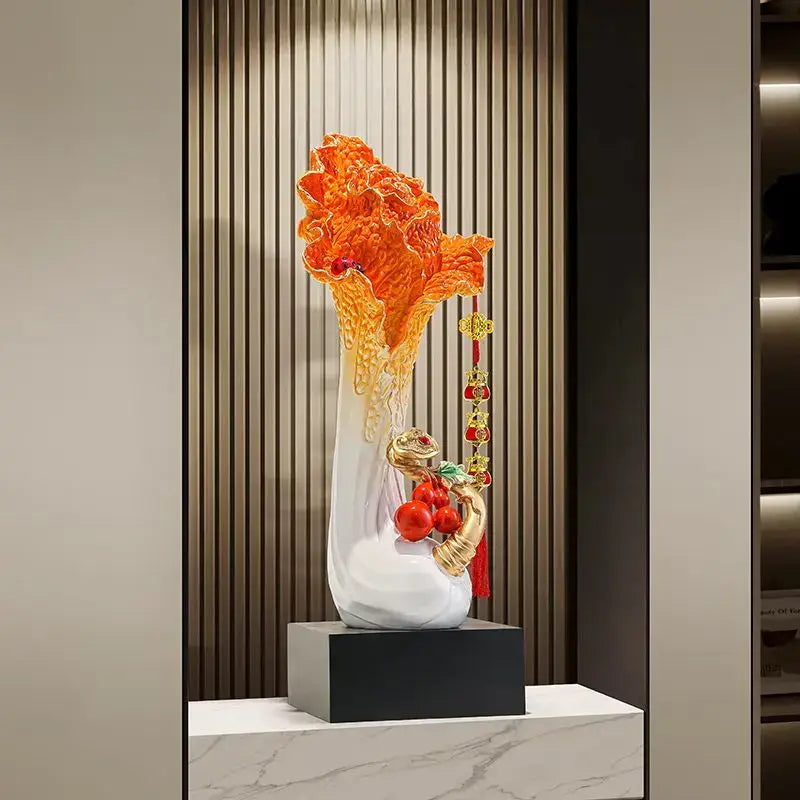 Vibrant orange glass sculpture with white ceramic base and gold accents featuring red elements decorbites cabbage ornament