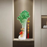 Glossy green and white ceramic cabbage ornament with gold accents red tassels and figurines for office decor by decorbites