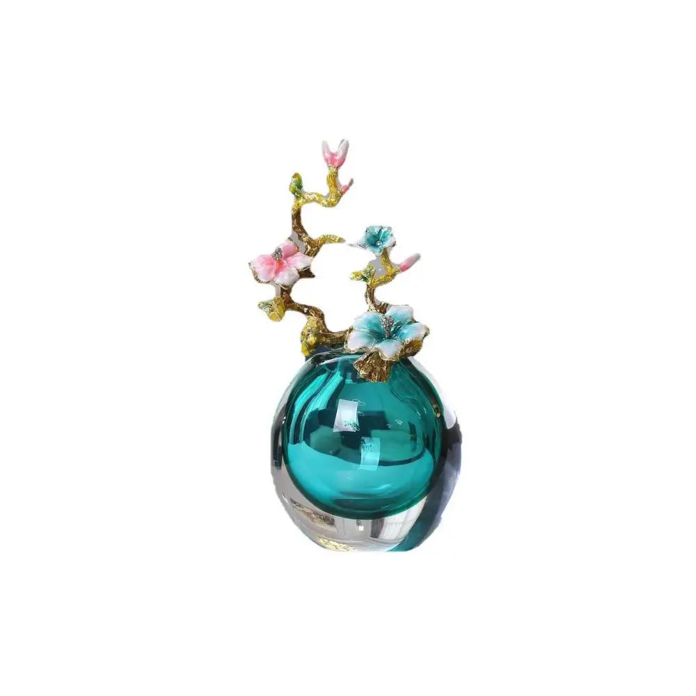 Teal glass perfume bottle with gold-toned floral branch decoration featuring enamel small ornaments for living room use