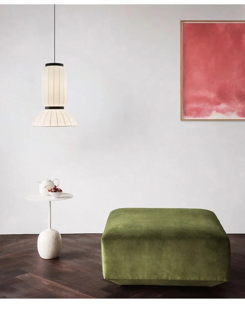 Olive green velvet ottoman paired with noguchi pendant shop hanging light and rice paper lantern light for dining room decor