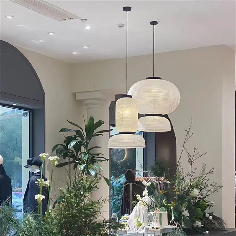 Three tiered off-white rice paper lantern light with black metal fixtures shop hanging light for dining room decor