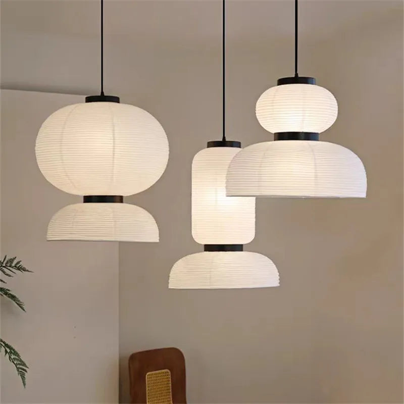 Noguchi pendant light with white rice paper lantern and black metal accents as a dining room shop hanging light