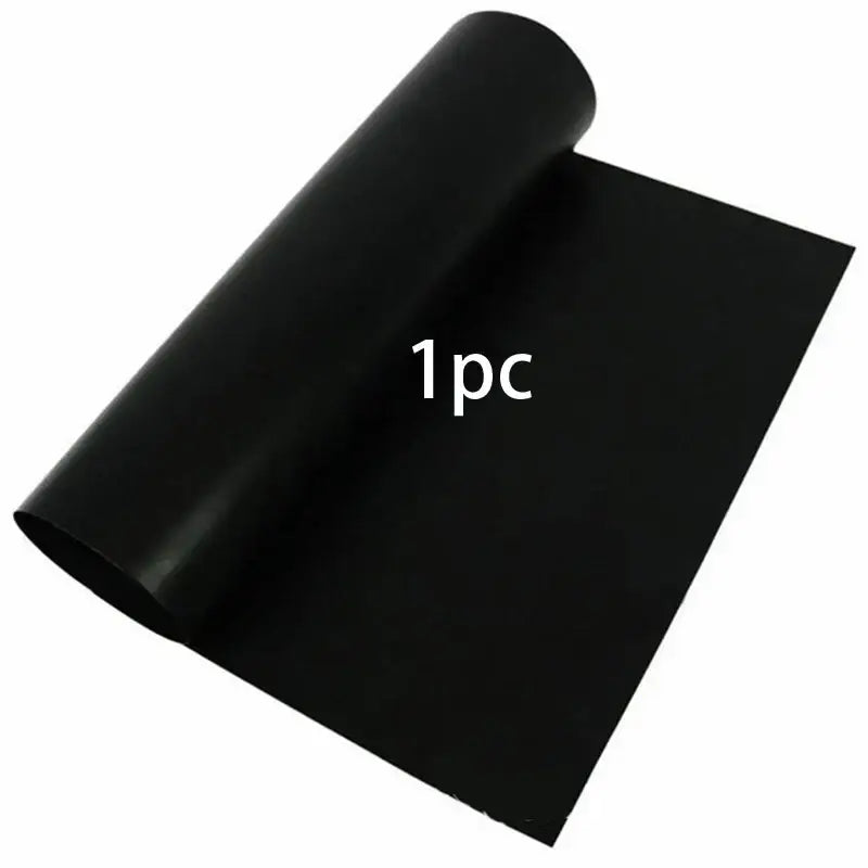 Black smooth-surfaced non-stick bbq grill mat roll made of flexible material for kitchen and outdoor cooking use