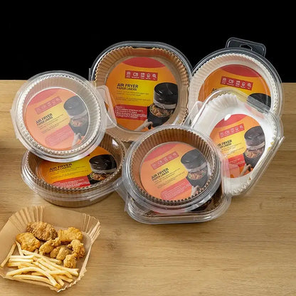 Clear plastic containers hold round fluted nonstick parchment paper liners for air fryer baking use