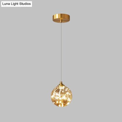 Nordic Amber Glass LED Pendant Lamp with Brass Finish and Starry Design for Bedroom