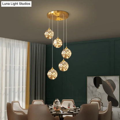 Nordic Amber Glass LED Pendant Lamp with Brass Finish and Starry Design for Bedroom