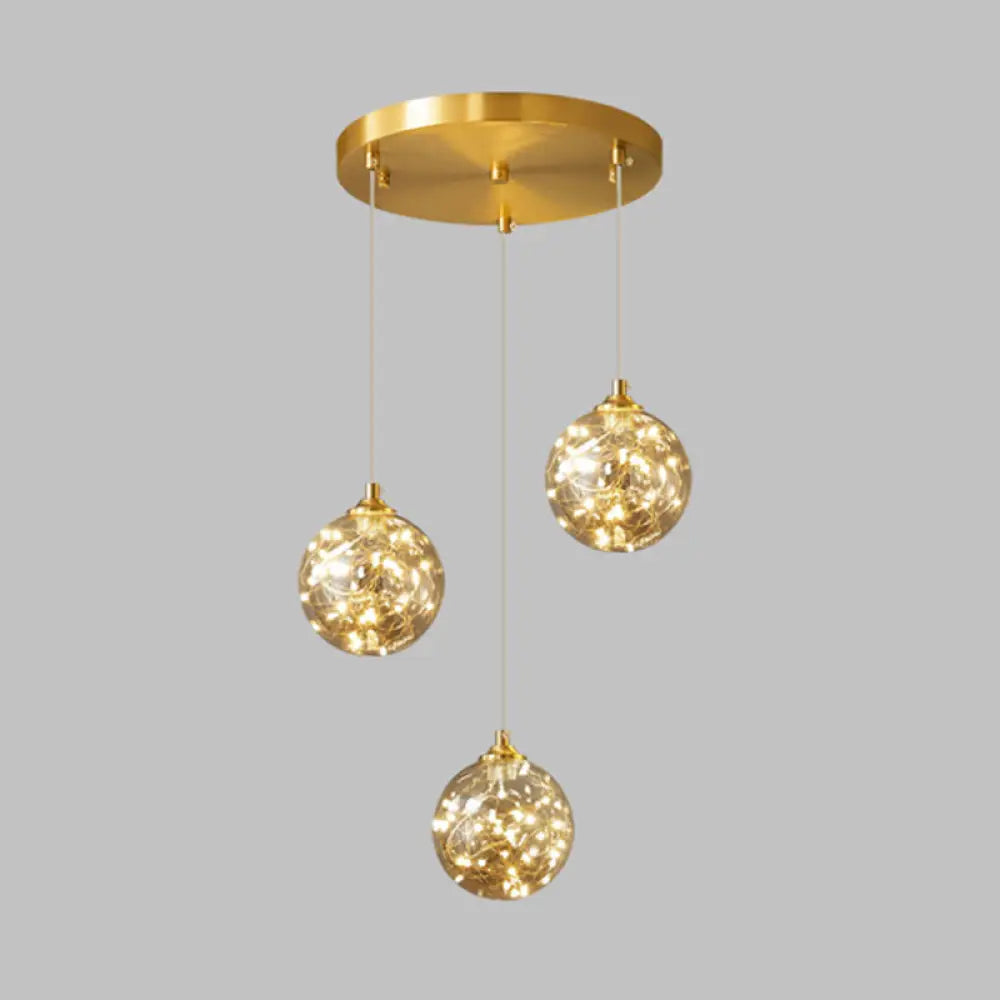 Nordic Amber Glass LED Pendant Lamp with Brass Finish and Starry Design for Bedroom