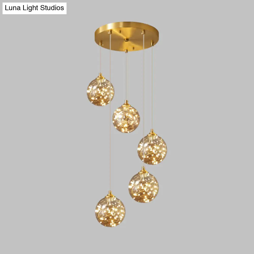 Nordic Amber Glass LED Pendant Lamp with Brass Finish and Starry Design for Bedroom