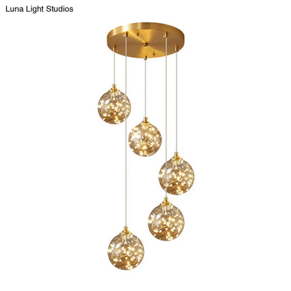 Nordic Amber Glass LED Pendant Lamp with Brass Finish and Starry Design for Bedroom