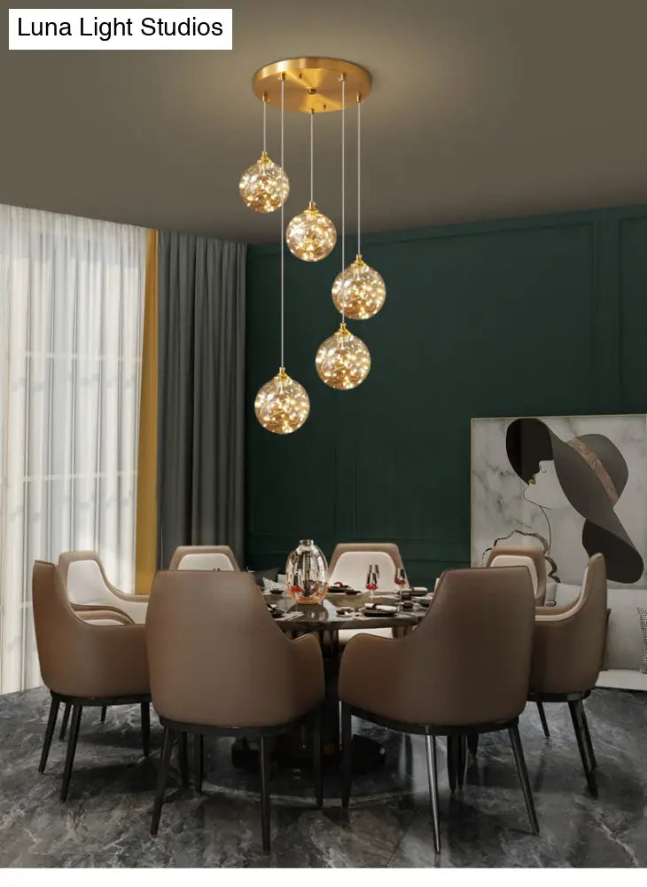 Nordic Amber Glass LED Pendant Lamp with Brass Finish and Starry Design for Bedroom