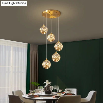 Nordic Amber Glass LED Pendant Lamp with Brass Finish and Starry Design for Bedroom