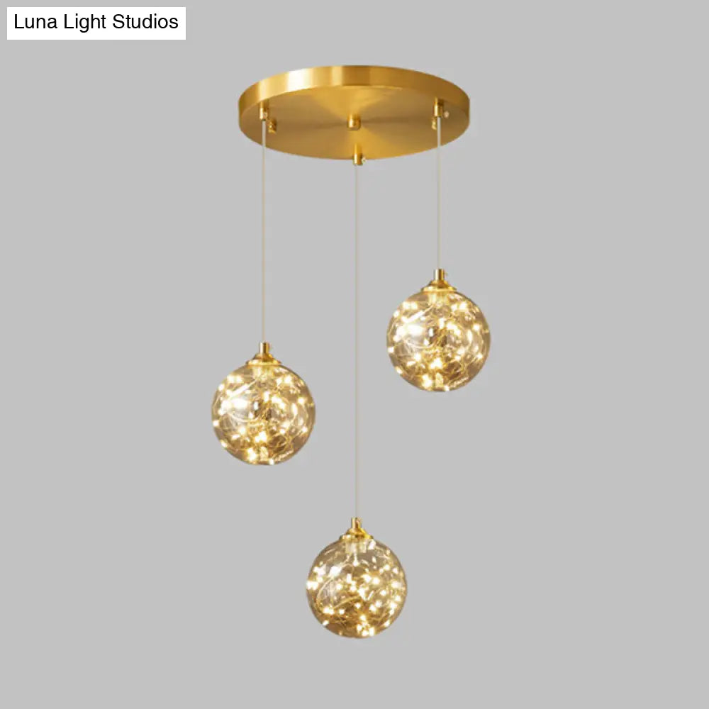 Nordic Amber Glass LED Pendant Lamp with Brass Finish and Starry Design for Bedroom