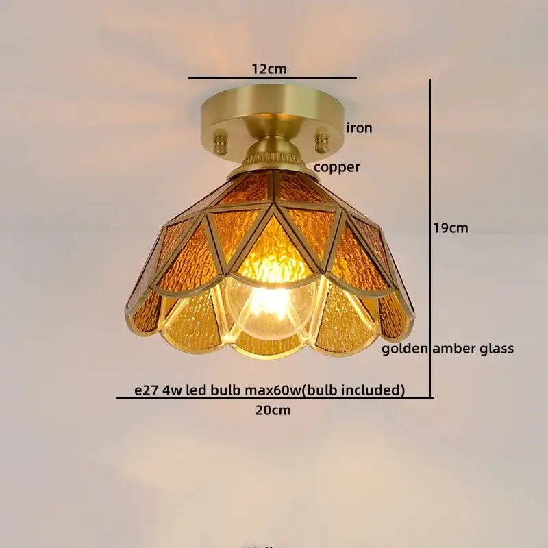 Vintage-style ceiling light with brass copper base and golden amber stained glass panels in geometric petal design
