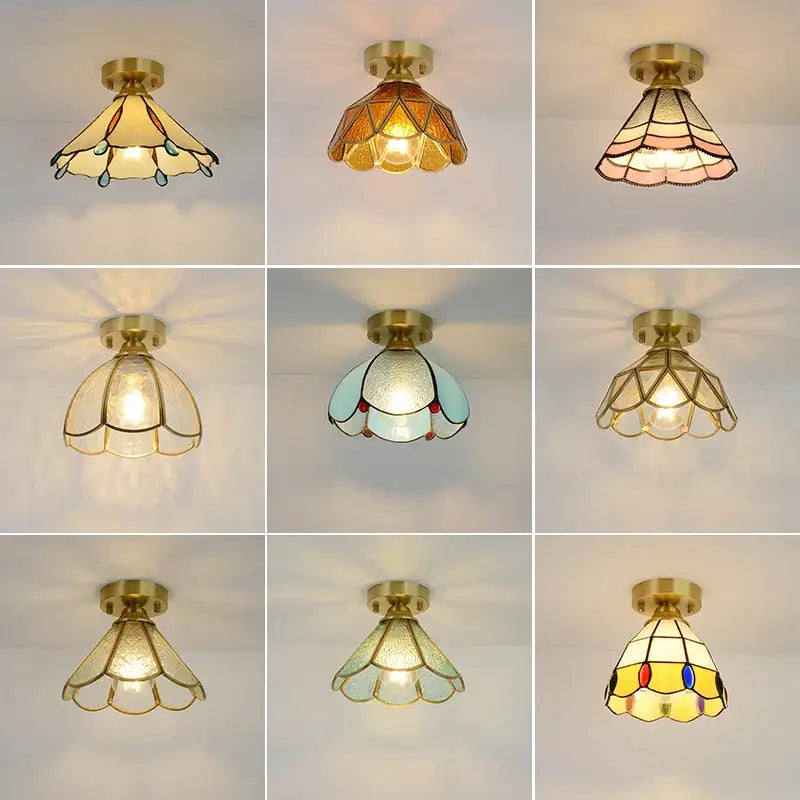 A collection of nine brass-finished glass copper led ceiling lights with amber and teal stained glass panels