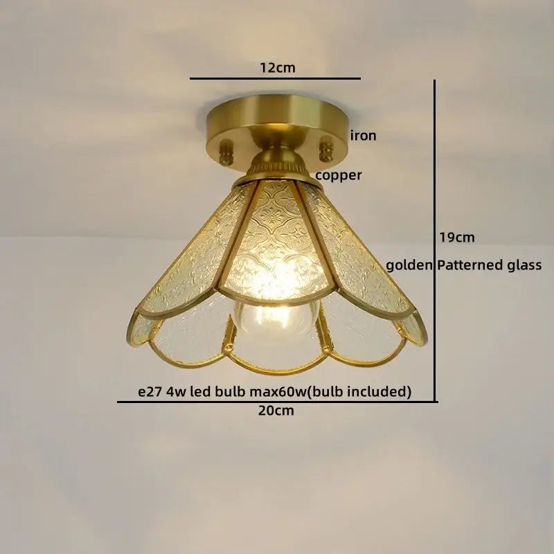 Vintage-style ceiling light with brass-finished iron and copper base and golden glass copper led petal shades
