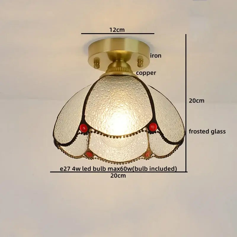Vintage-style bedroom ceiling light with brass-finished copper base and frosted glass copper led shade with red accents