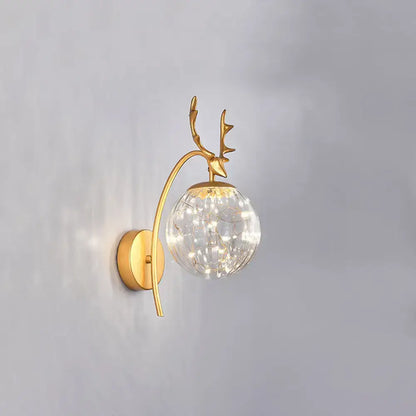 Gold-toned nordic ball wall mount deer-head sconce with crackled glass globe and fairy lights for bedroom decor