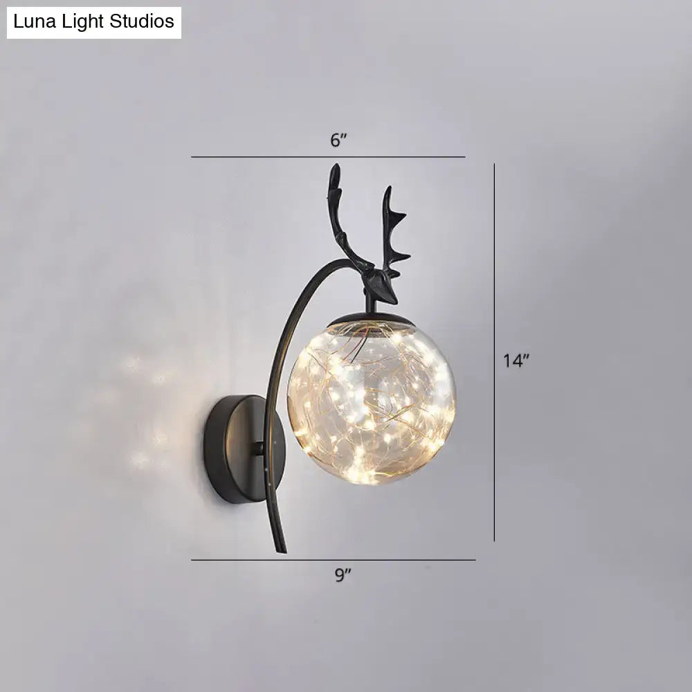 Black metal nordic ball wall deer-head sconce with spherical glass globe and warm fairy lights for bedroom use