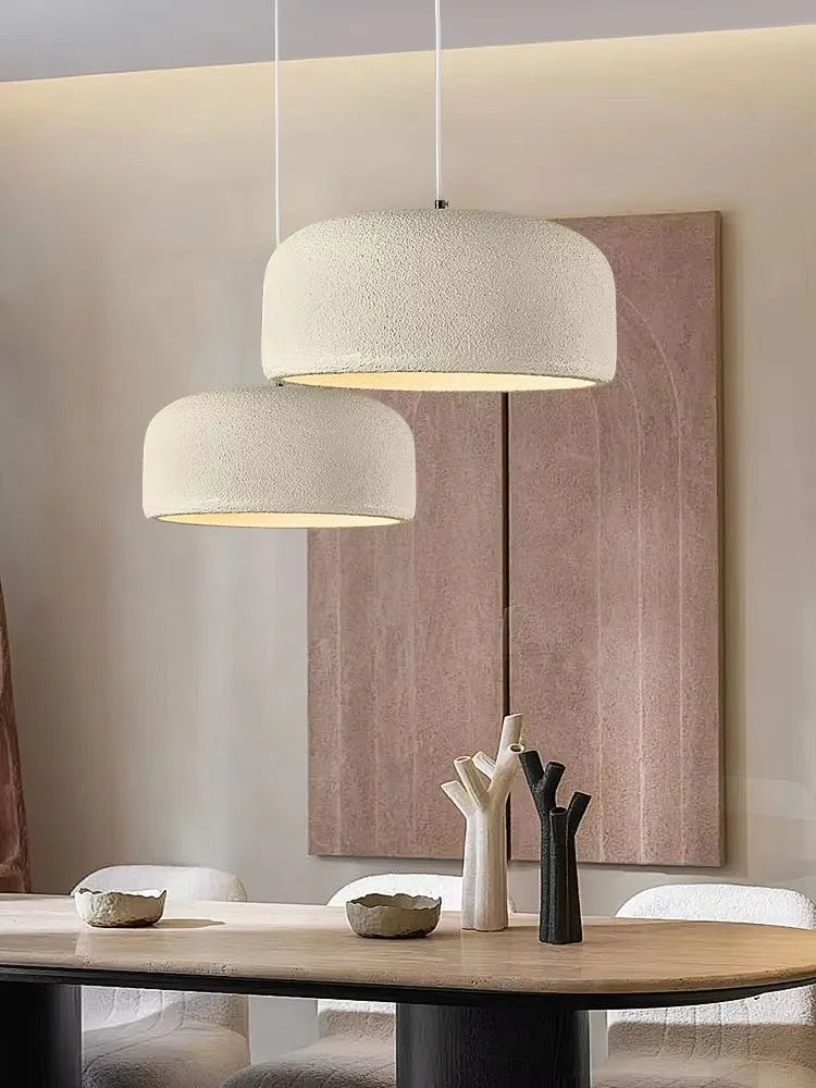 Two off-white textured nordic led pendant lamps with soft diffused glow for bar and restaurant lighting
