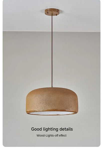A warm-toned textured wooden led pendant lamp with sleek metal rod for bar and restaurant lighting