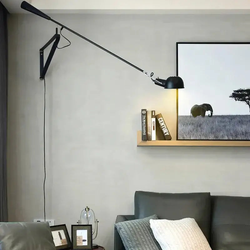 Black articulated wall lamp with adjustable long arm and sleek modern design for bedroom lighting