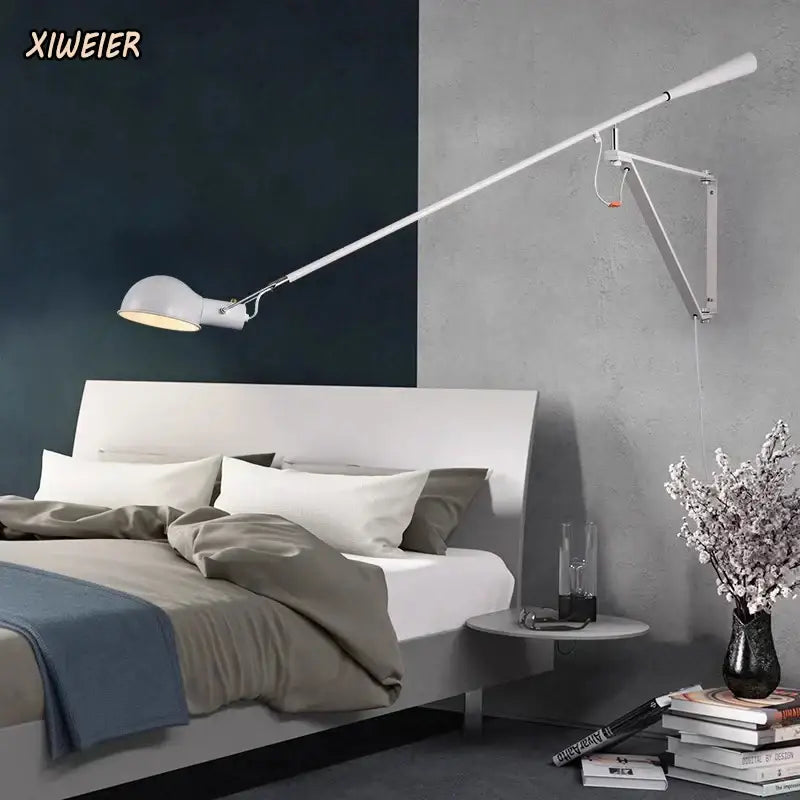 White wall lamp with adjustable long arm metallic design and softly glowing rounded shade for bedroom lighting