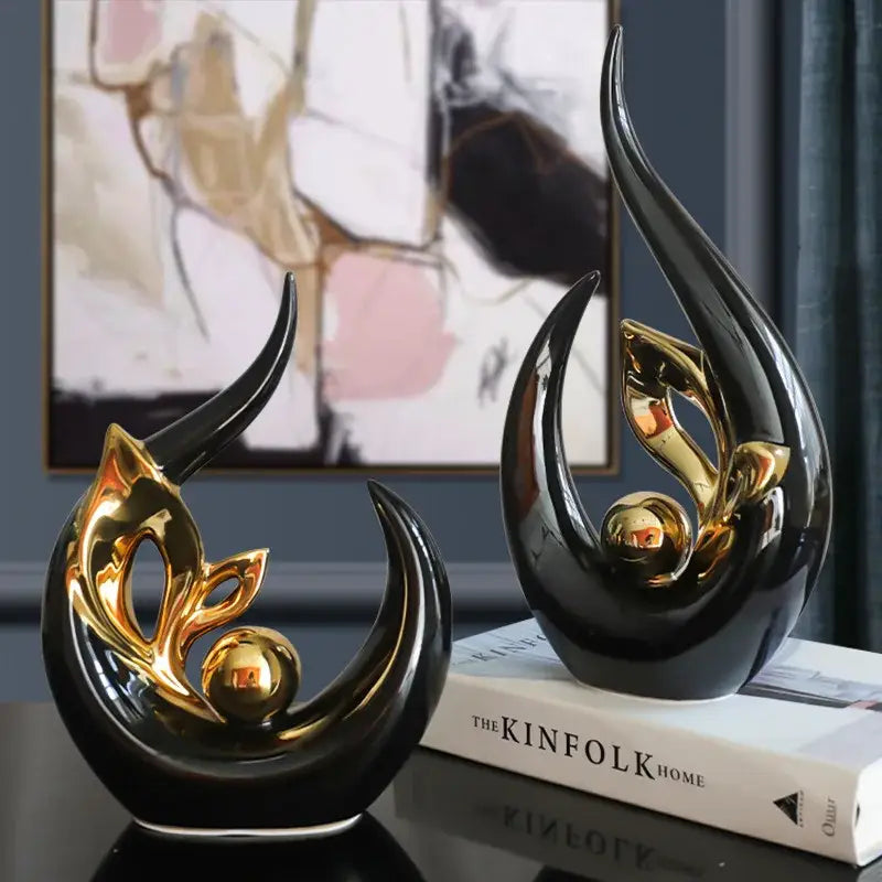 Nordic black and gold ceramic figurine with sleek curved forms and metallic accents for living room desk decor