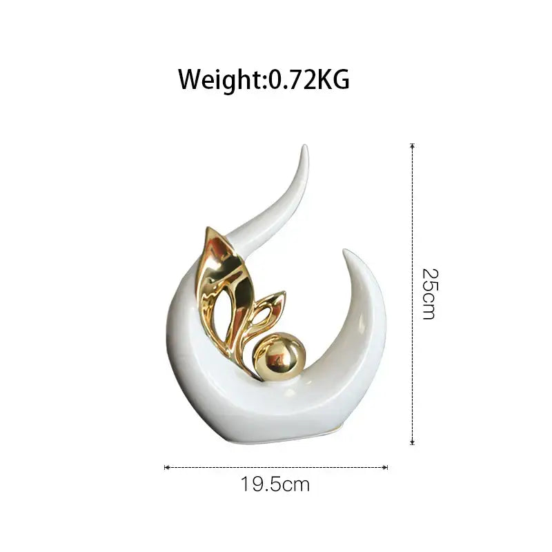 A sleek white nordic ceramic figurine with intertwined golden leaves and a polished gold sphere for desk decor
