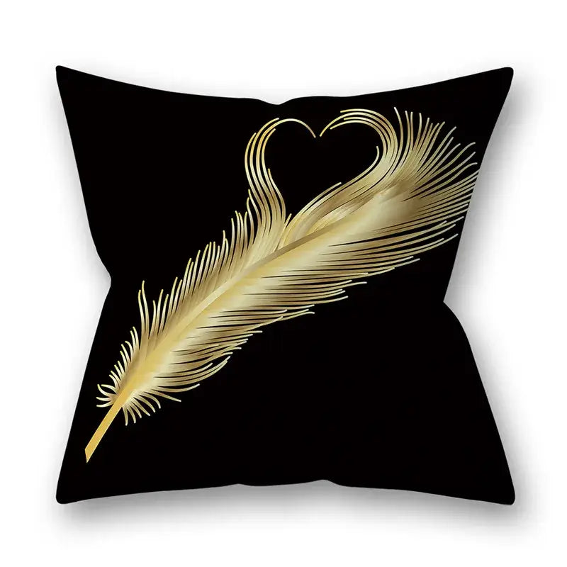 Black throw pillow featuring a golden leaves pillow design with heart-shaped feather barbs for living room decor