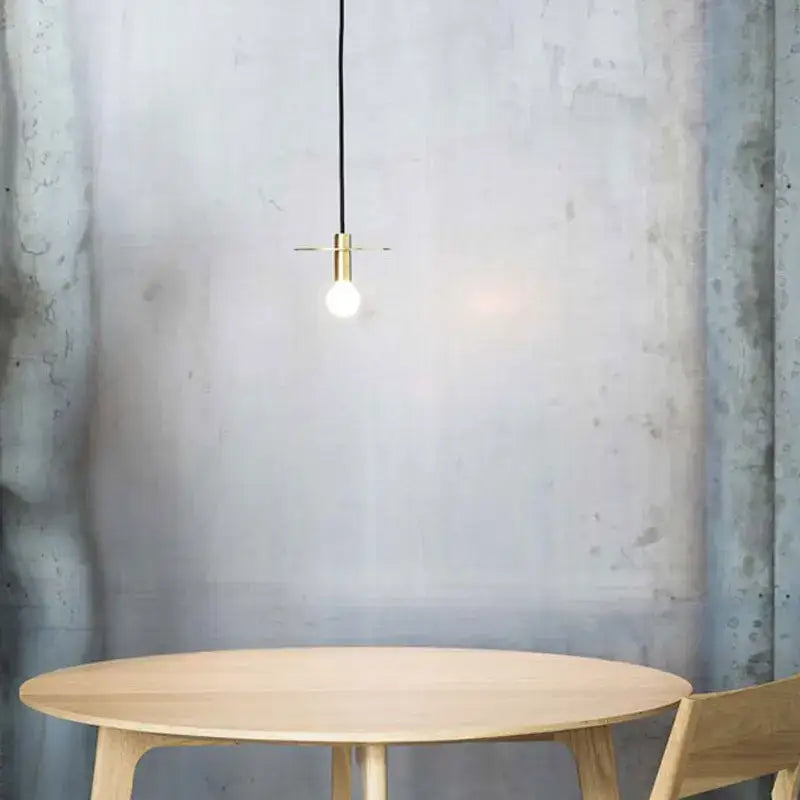 Minimalist nordic black iron pendant light with brass-finished fixture and exposed bulb for dining room decorbites iron pendant