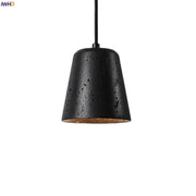 Black travertine pendant light with textured matte finish and warm interior lining for dining room decorbites black travertine