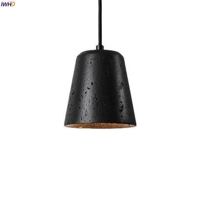 Black travertine pendant light with textured matte finish and warm interior lining for dining room decorbites black travertine