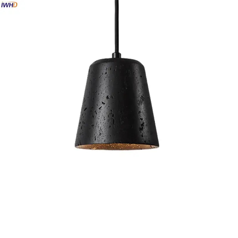 Black travertine pendant light with textured matte finish and warm interior lining for dining room decorbites black travertine